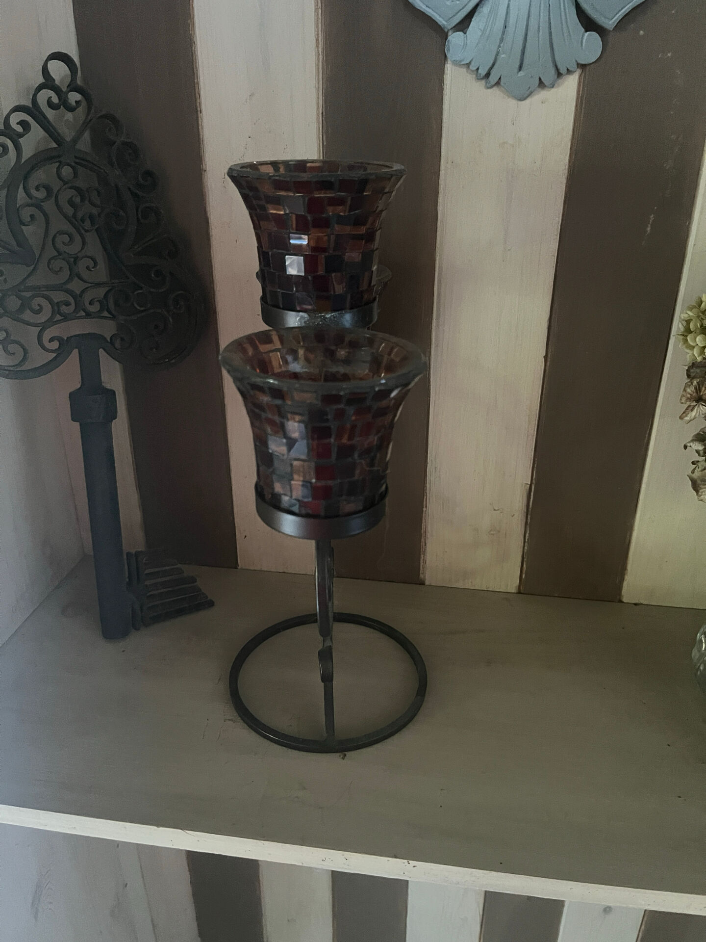 Three-branch candlestick in wrought iron and glass mosaic.