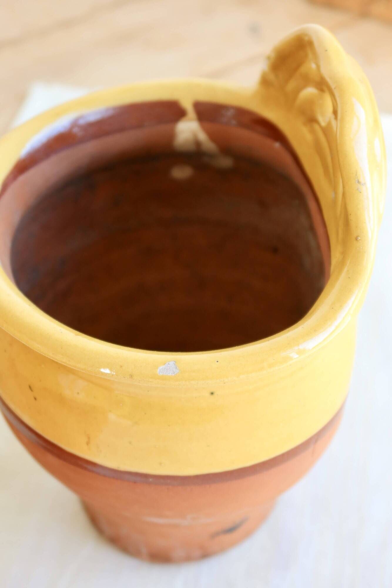 Pair of vintage wall planters in yellow glazed stoneware.