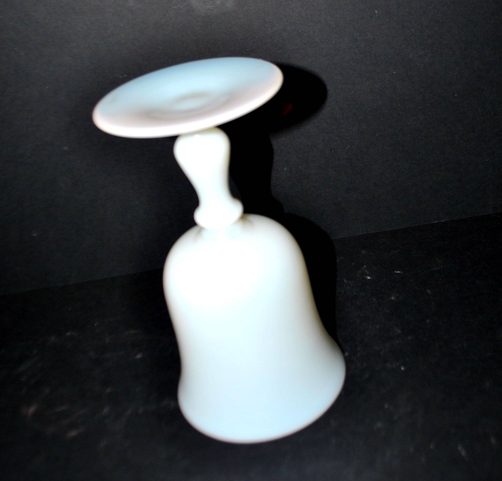 Ancient opaline white glass goblet with a soap bubble effect.