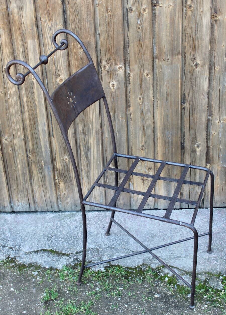 Series of 8 wrought iron garden chairs