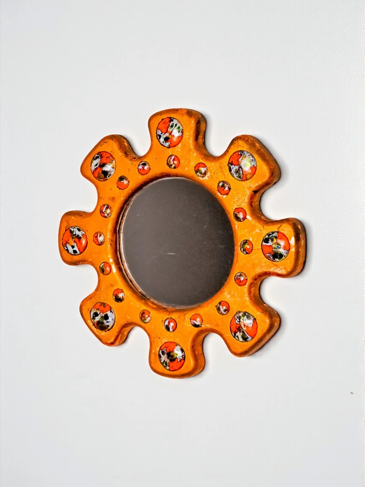 Sun-shaped modernist enamel mirror by J. Capo Esmaltes, Spain, 1970s