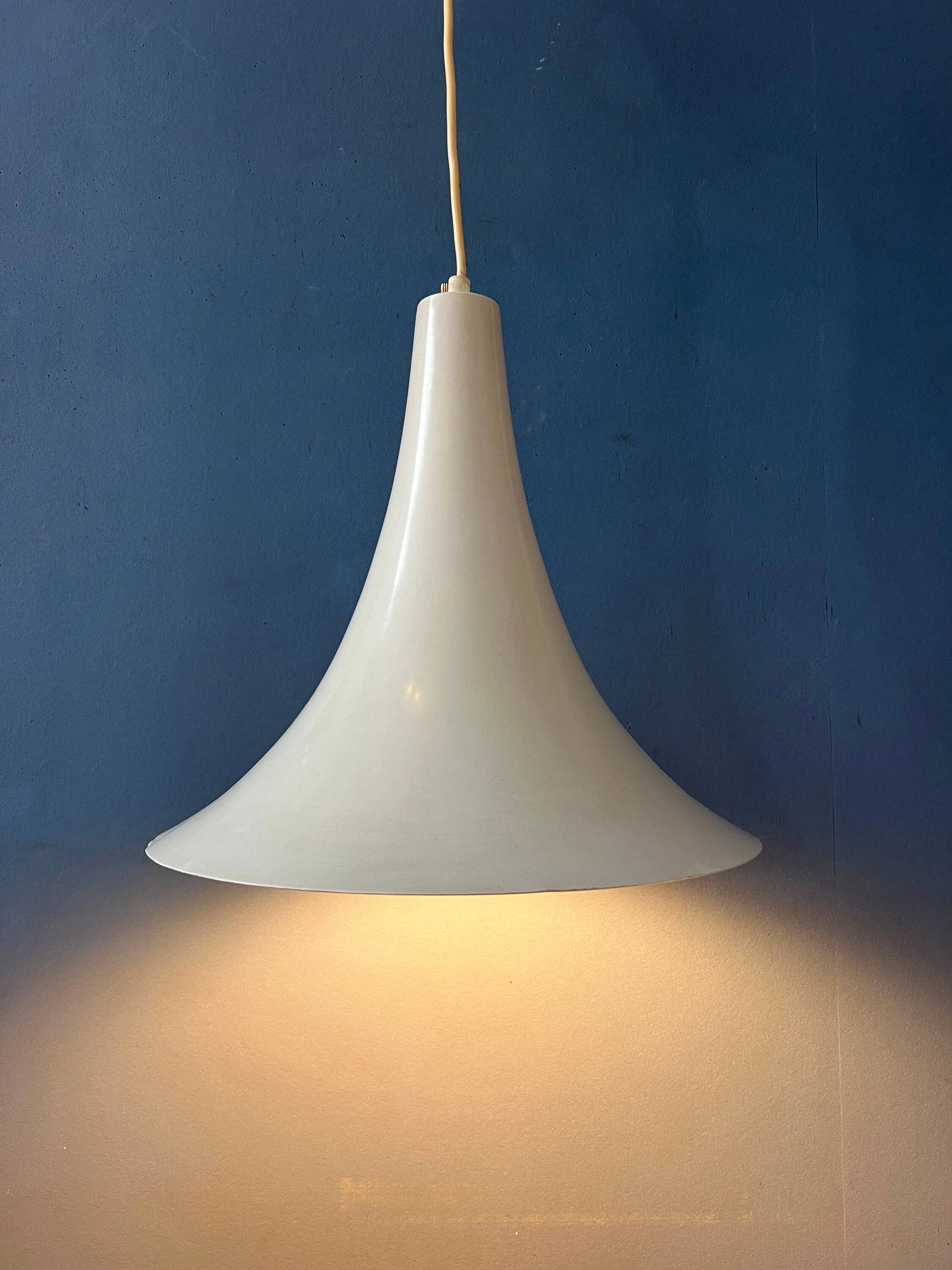 Small vintage beige pendant light in the shape of a witch's hat.