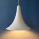 Small vintage beige pendant light in the shape of a witch's hat.