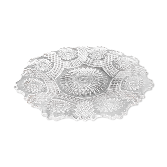 Vintage pressed glass plate with rosette design, octagonal rim, star pattern reminiscent of mandala