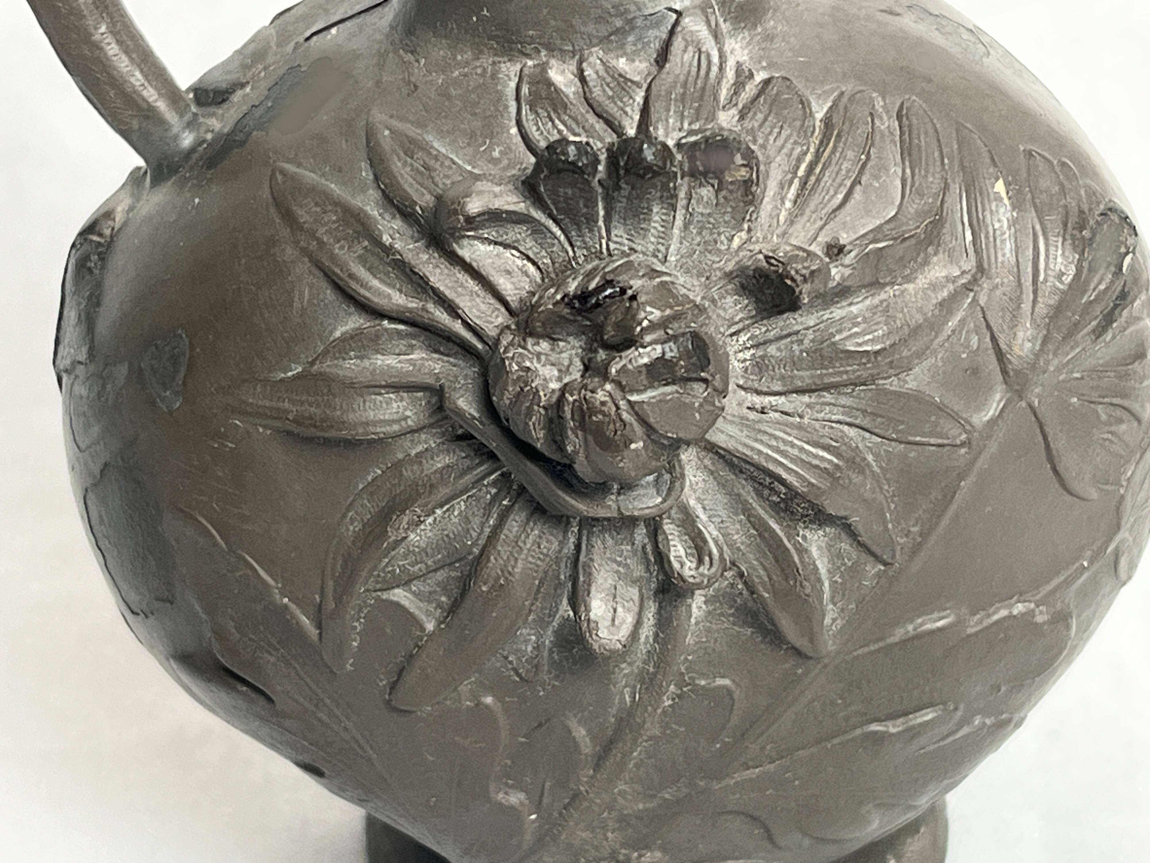 Art Nouveau, a single flower vase jug in pewter signed Petiz around 1900.