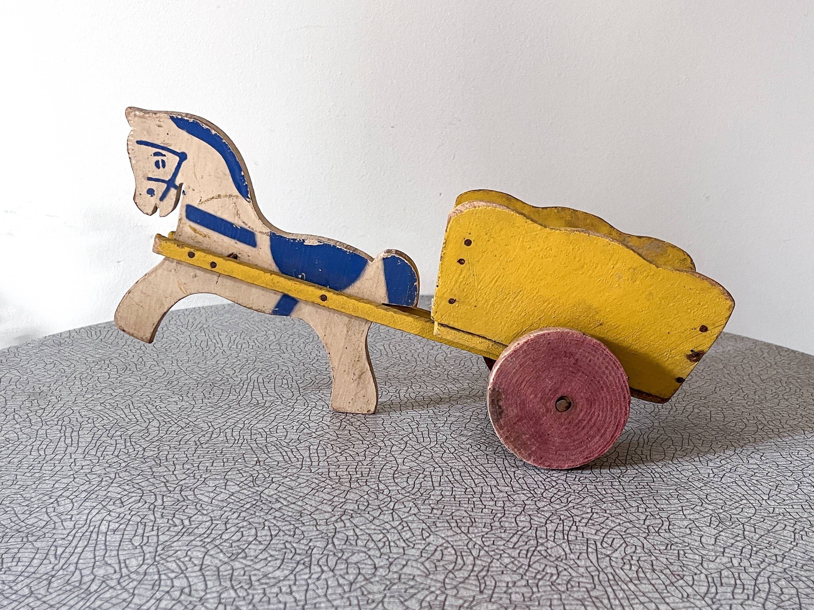 Horse cart and cart, old wooden pull toy.
