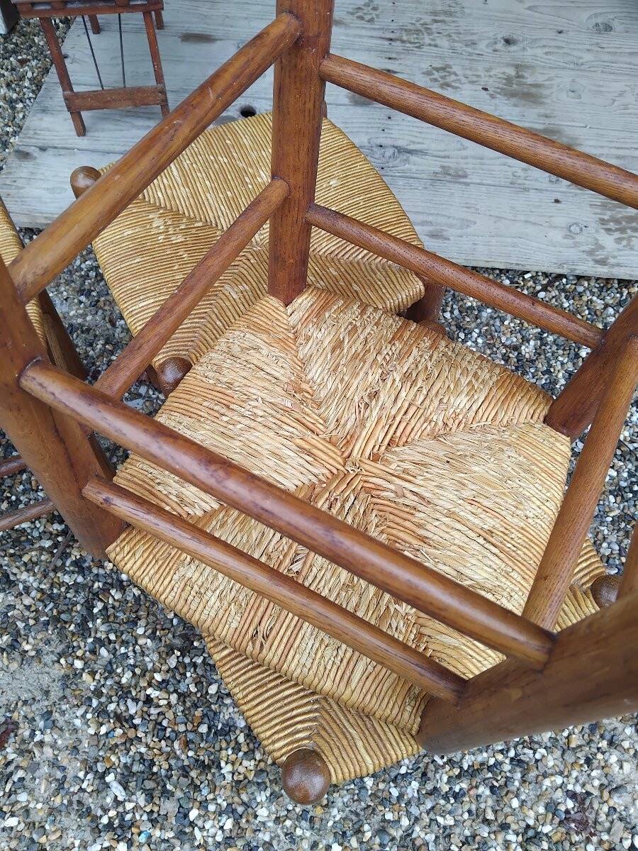 Suite de quatre tabourets - chêne et paille - v . 1950.