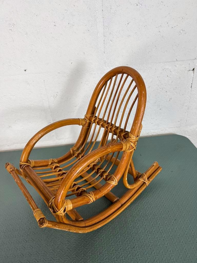 Vintage doll rocking chair in rattan