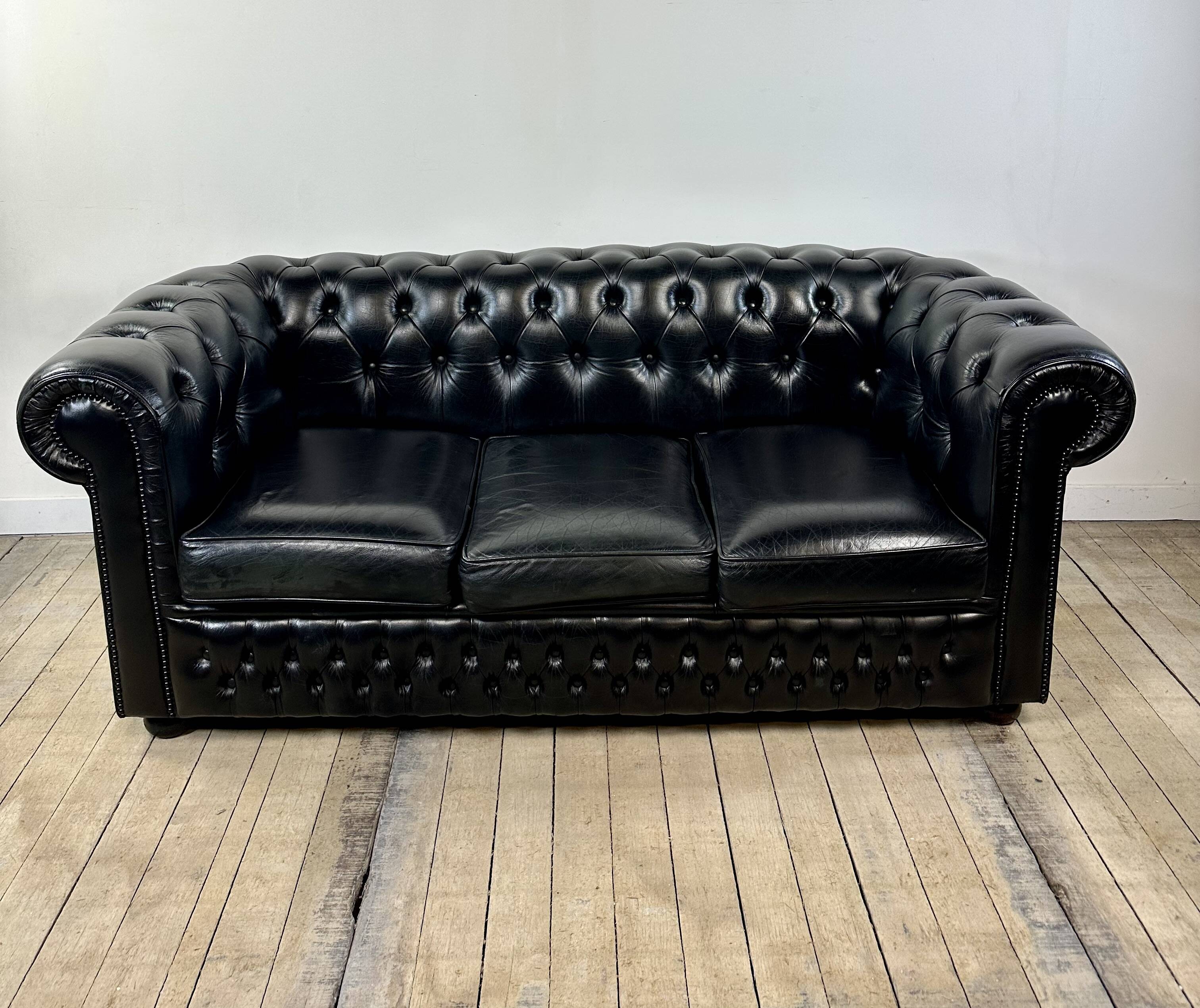 Vintage 1980 black leather Chesterfield sofa