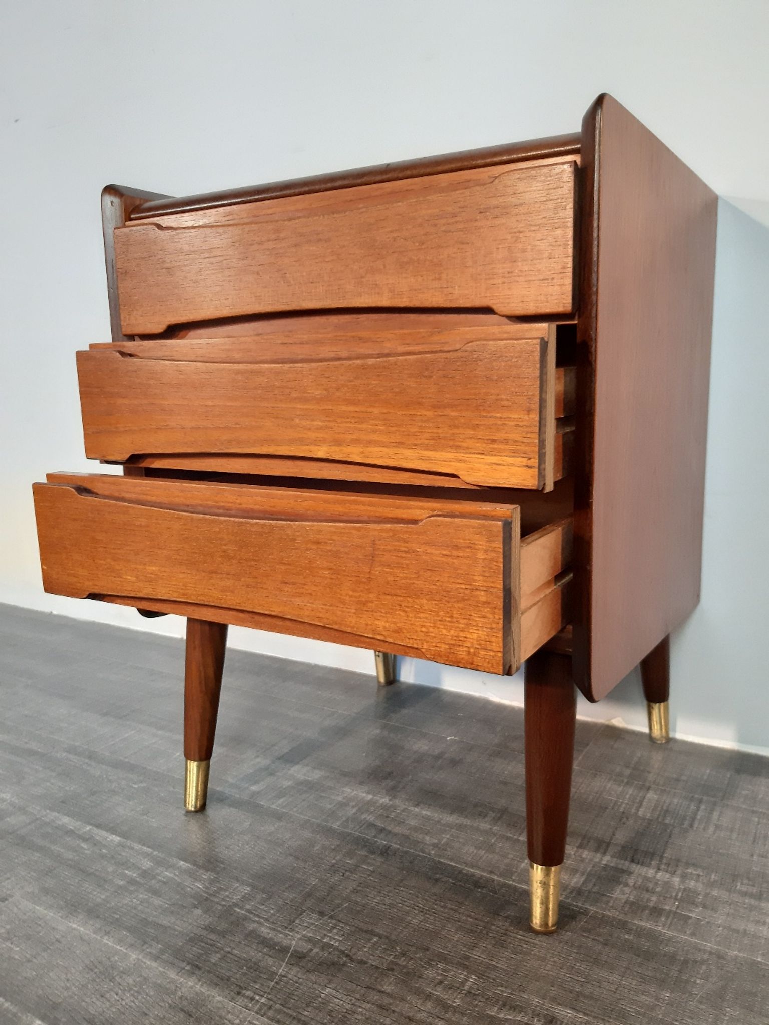 Norwegian bedside table with 3 drawers, teak and brass clogs