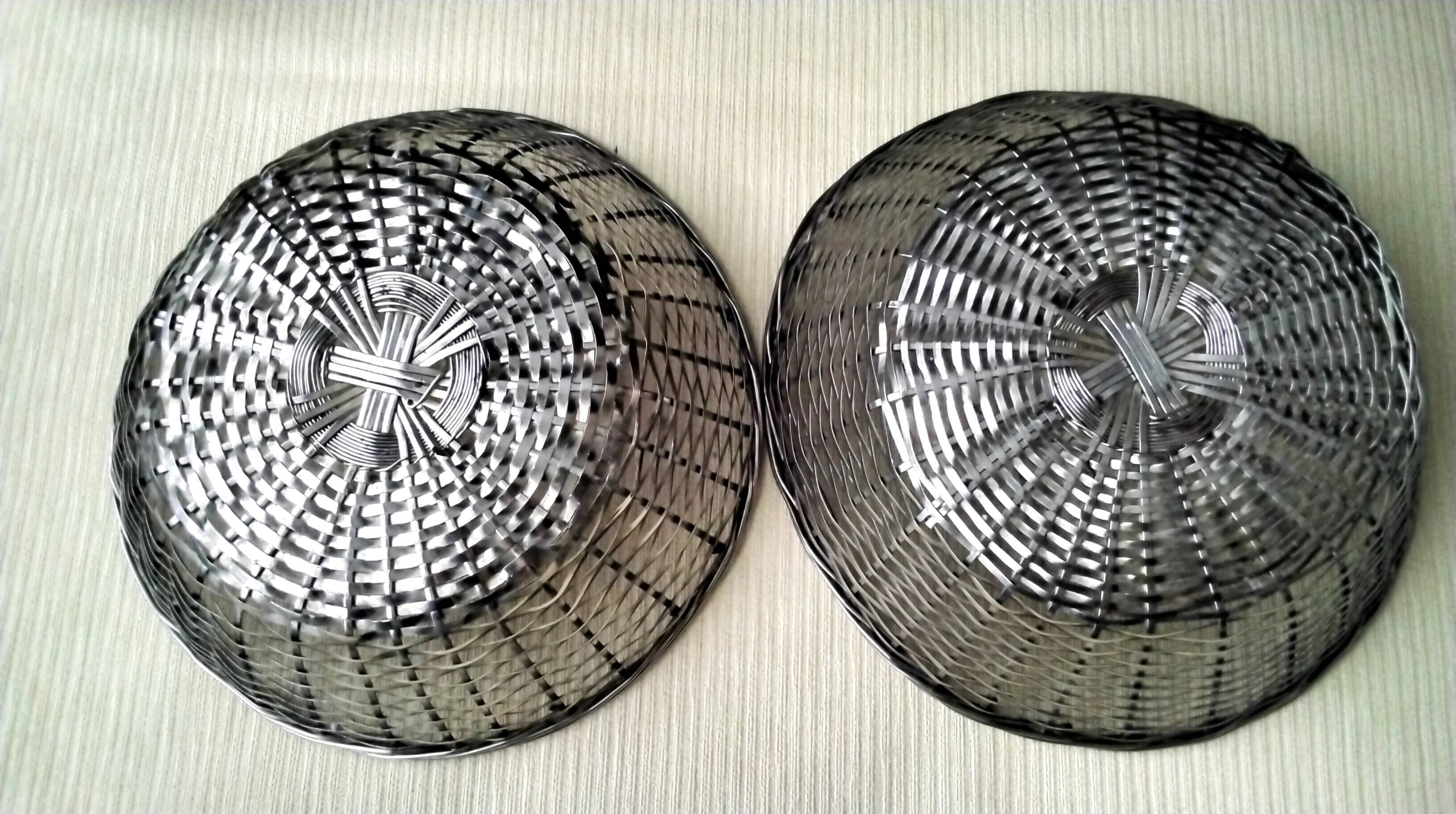 Pair of bread baskets, woven silver-plated wire baskets