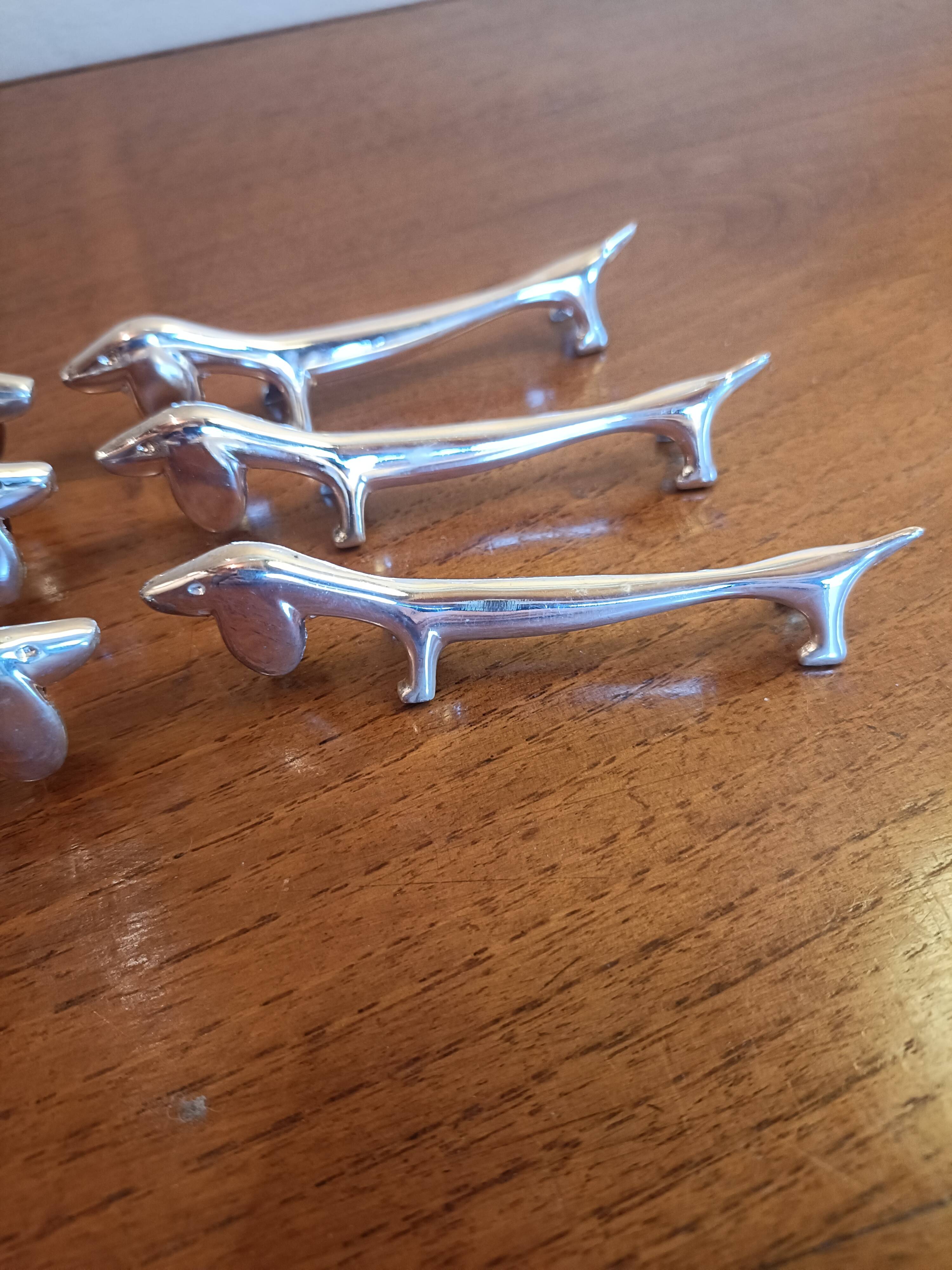 Six silver metal knife holders basset hound