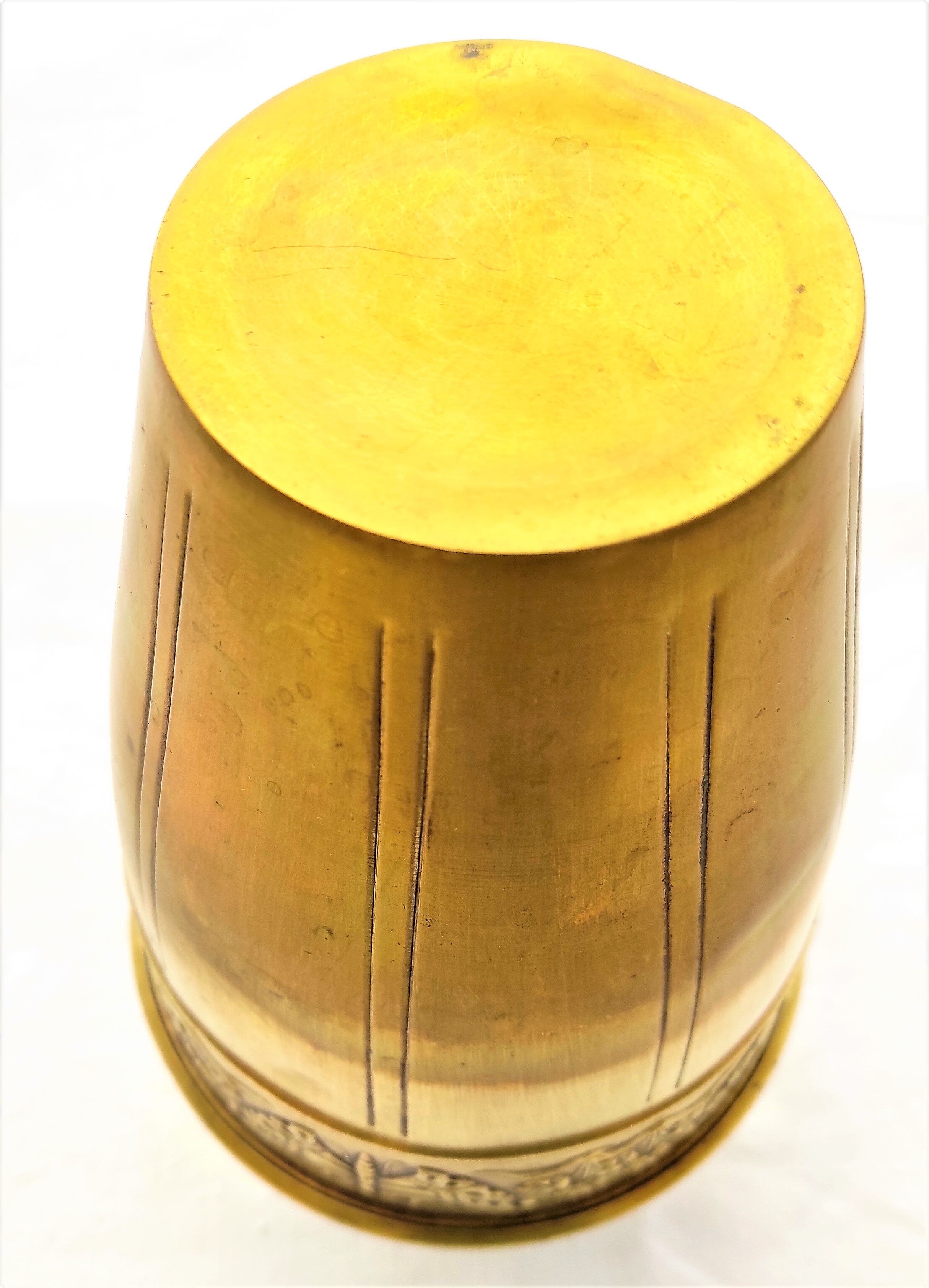 Vase in brass worked with flowers and butterflies around 1930