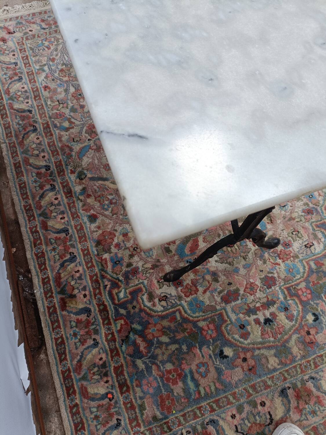 Bistro table with cast iron legs and marble top