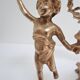 Pair of vintage golden brass cherub candlesticks
