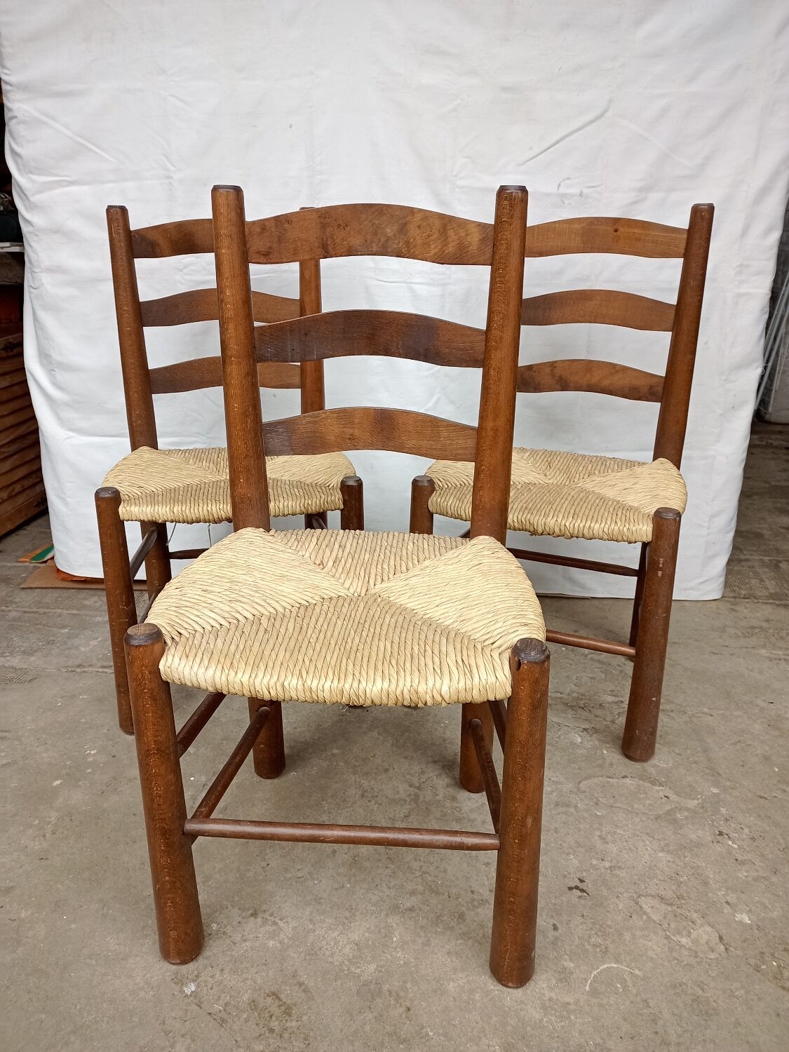 Brutalist chairs in walnut and straw
