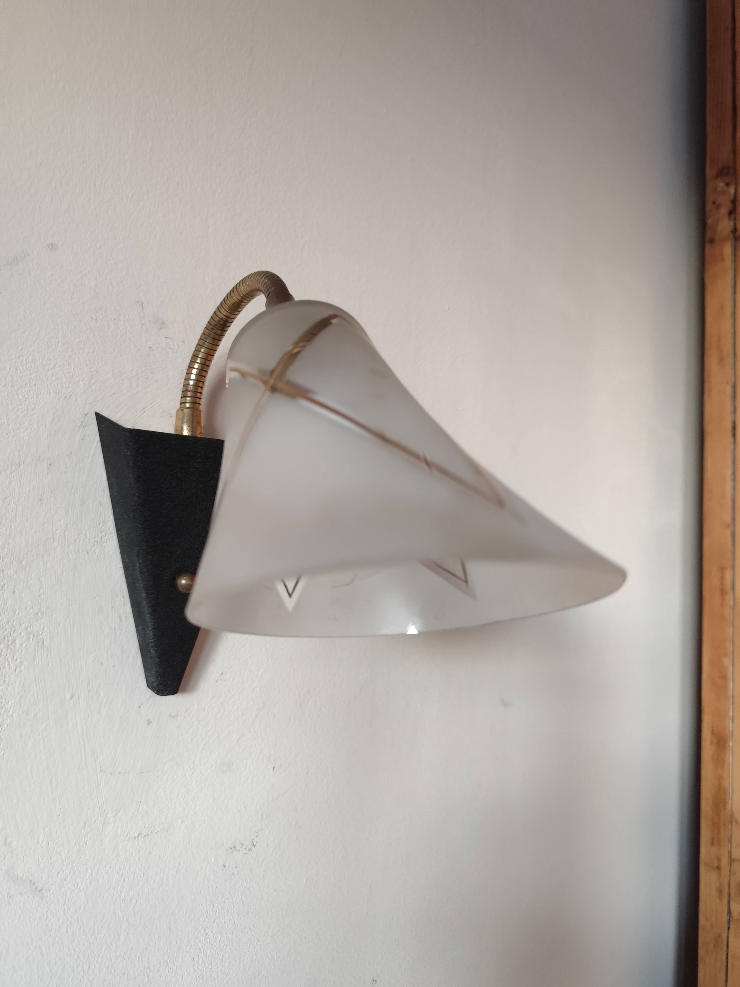 1950s wall lamp, metal, flexible brass stem and opaque shade.