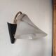 1950s wall lamp, metal, flexible brass stem and opaque shade.