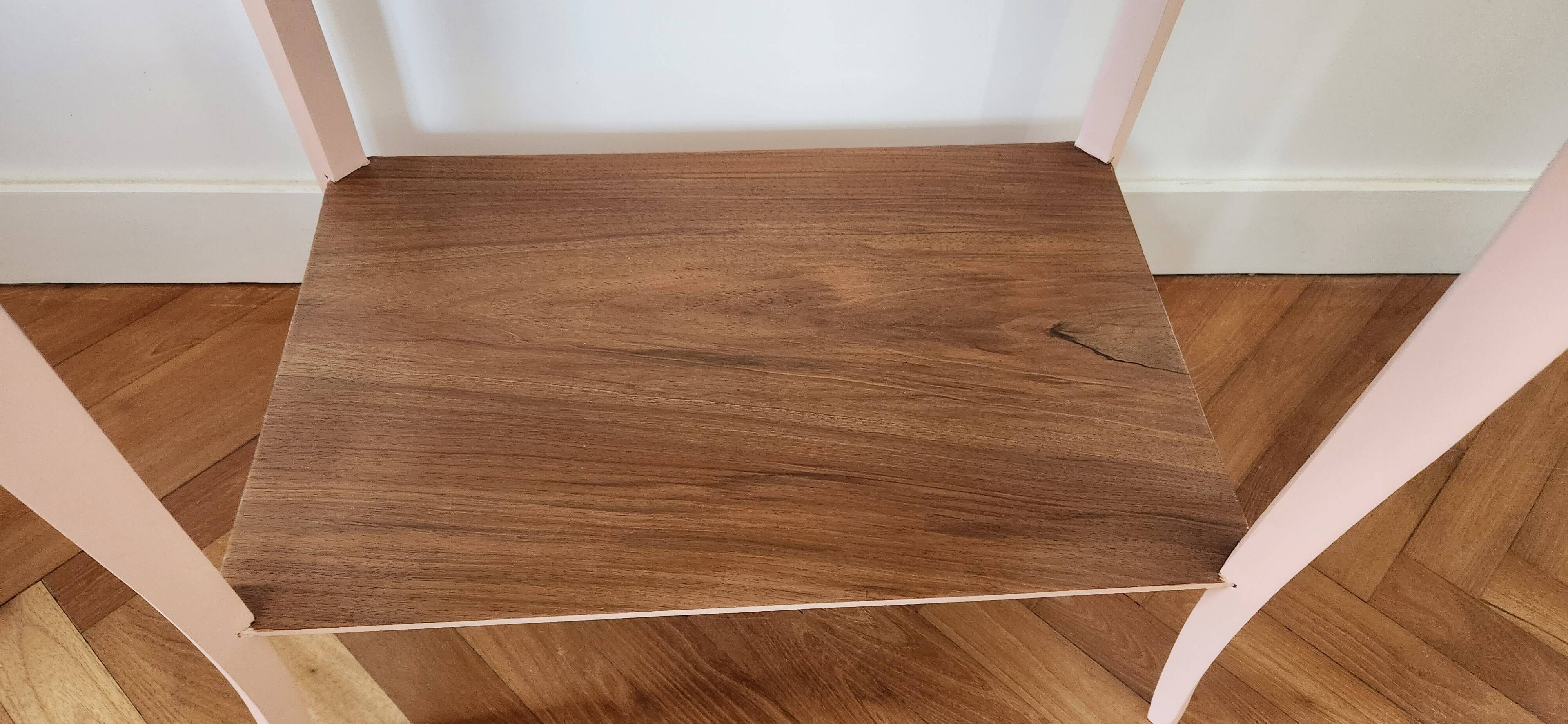 Side table with curved pink legs