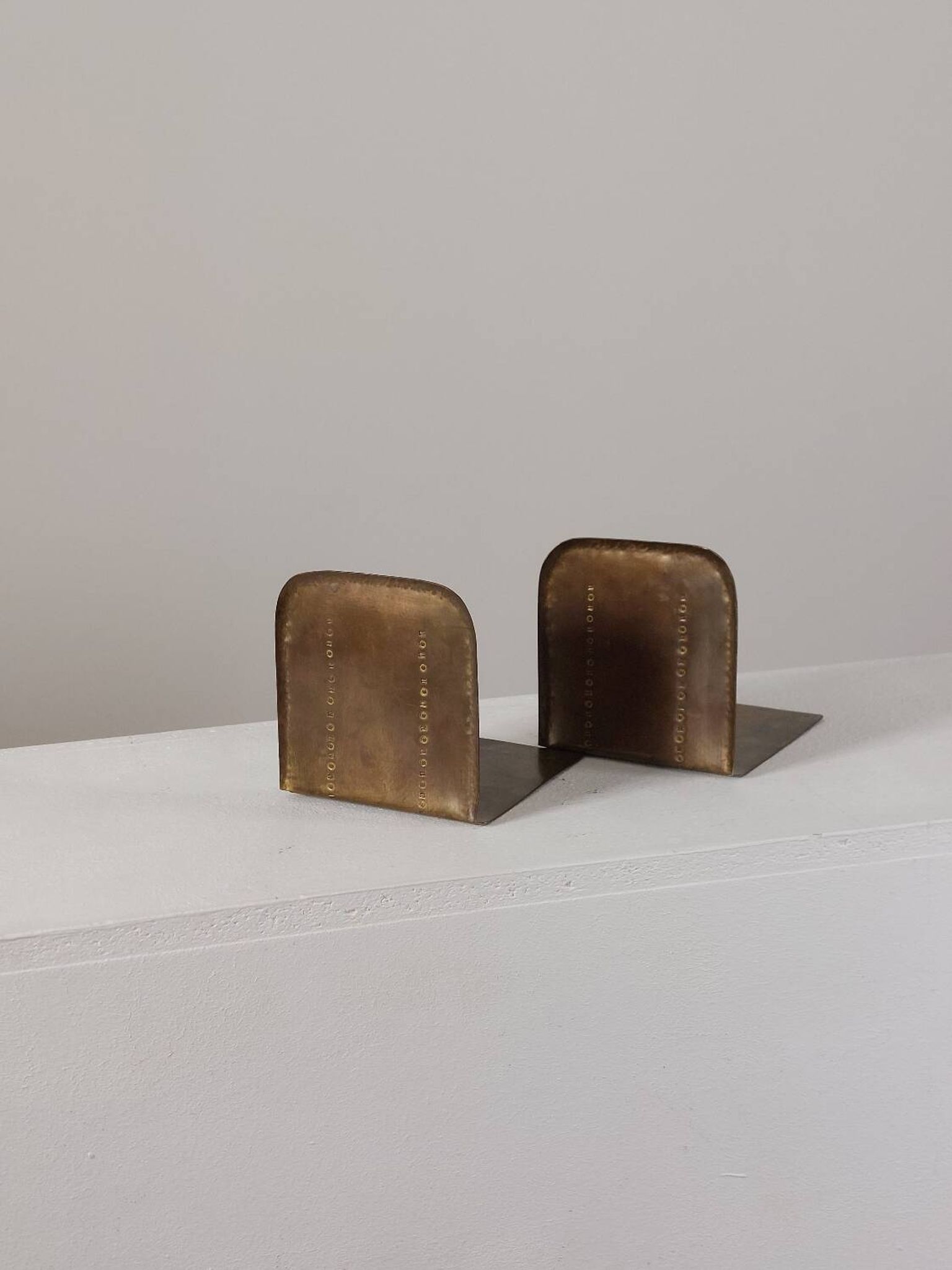 Pair of hand-hammered brass bookends by Hayno Focken
