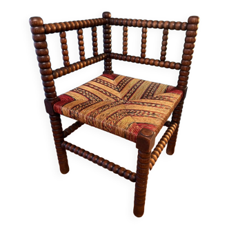 Corner armchair in straw and wood