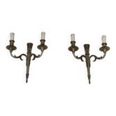 Pair of Louis XVI style wall sconces in bronze with an off-white patina