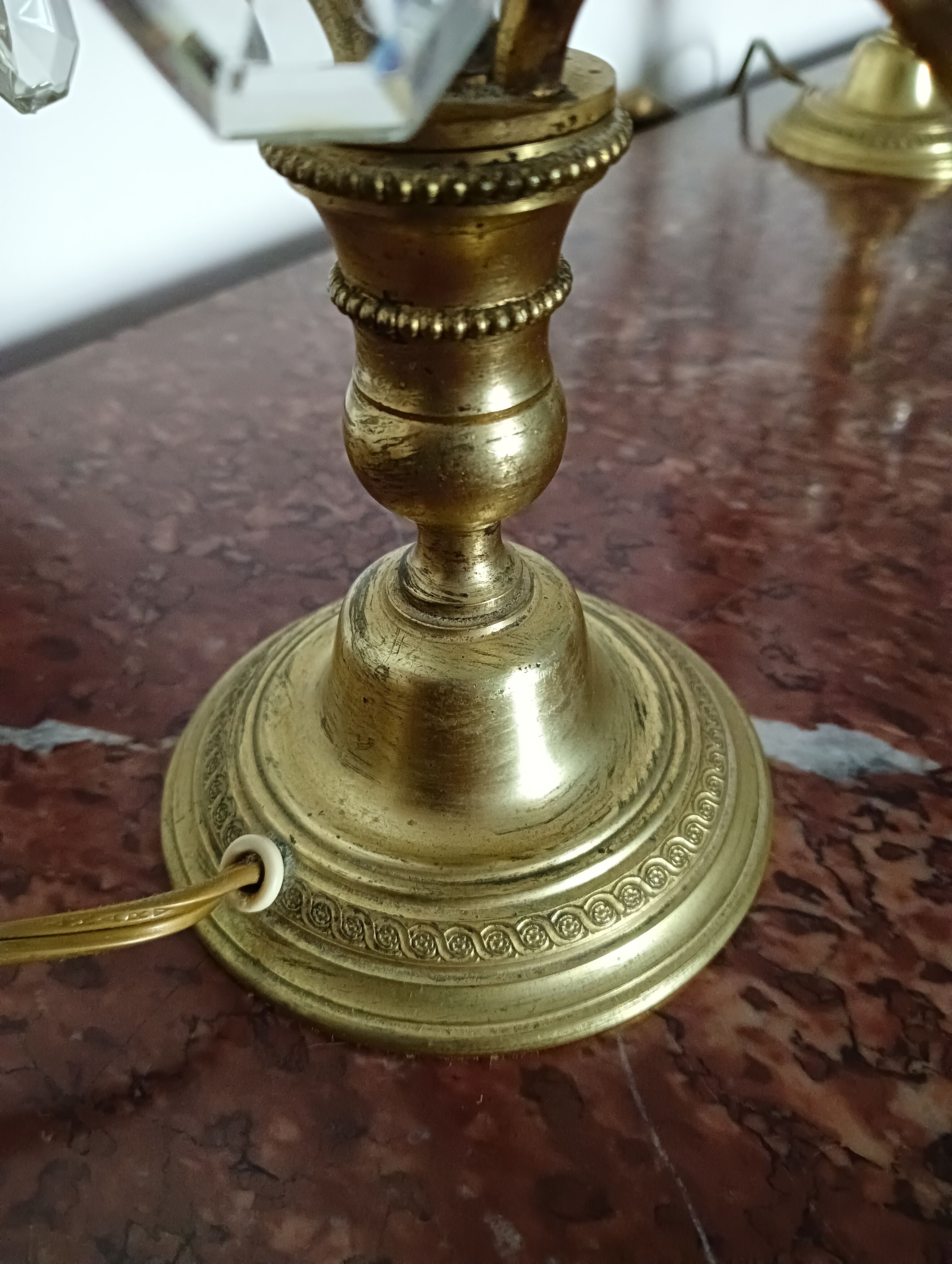 Pair of bronze girandoles with crystal pendants, two arms of lights.