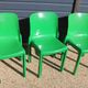 Set of 4 green Selene Magistretti chairs.