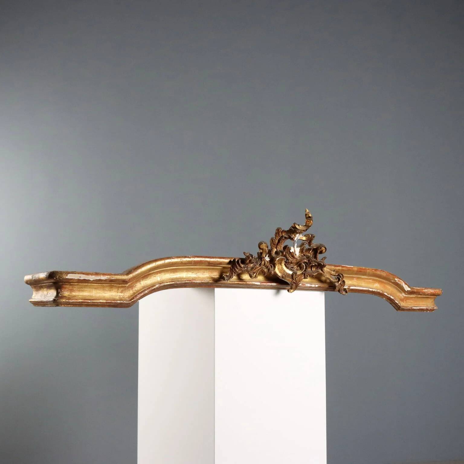 Golden wooden cornice with rocaille carving