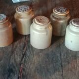 Lot of seven sandstone spice pots