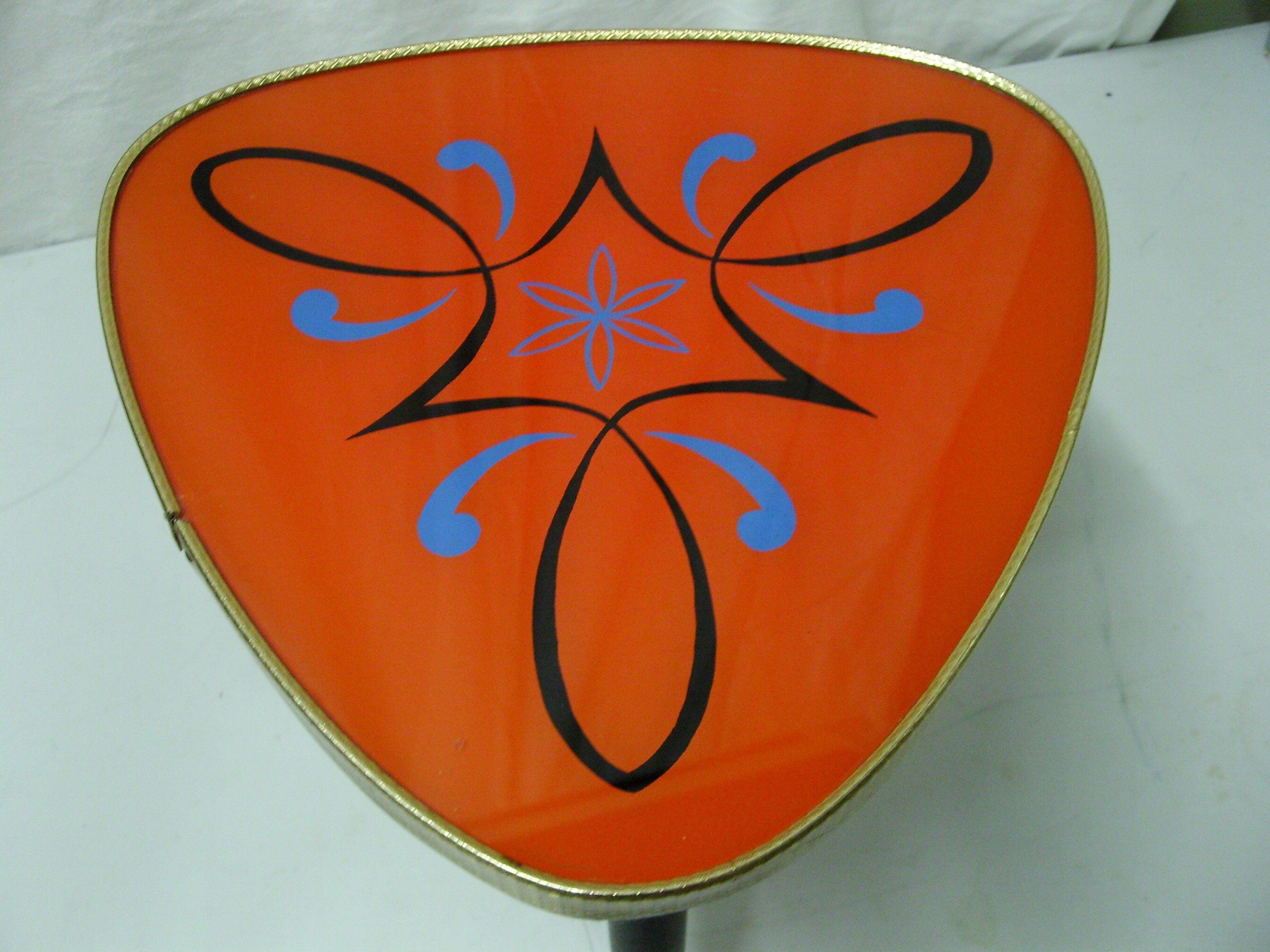 Plant holder tripod in geometrically patterned orange formica