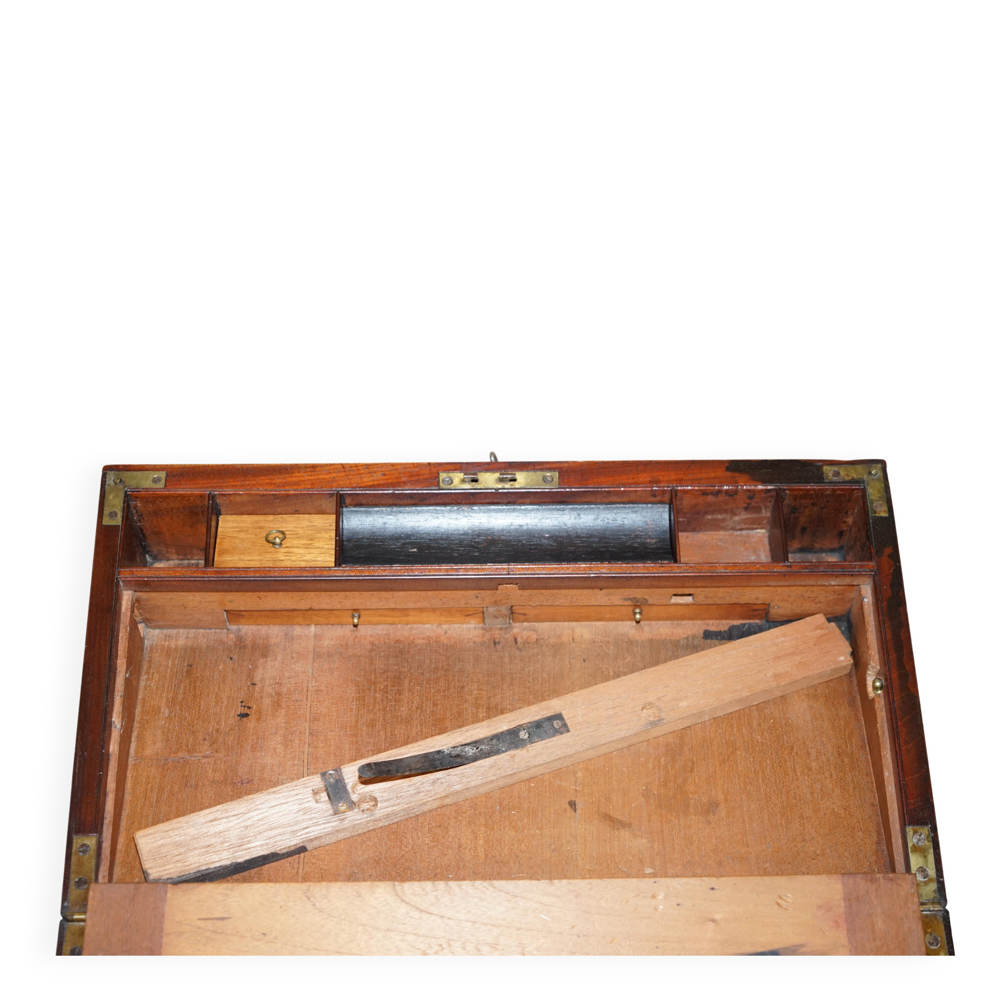 Antique hardwood military campaign desk with writing slope.