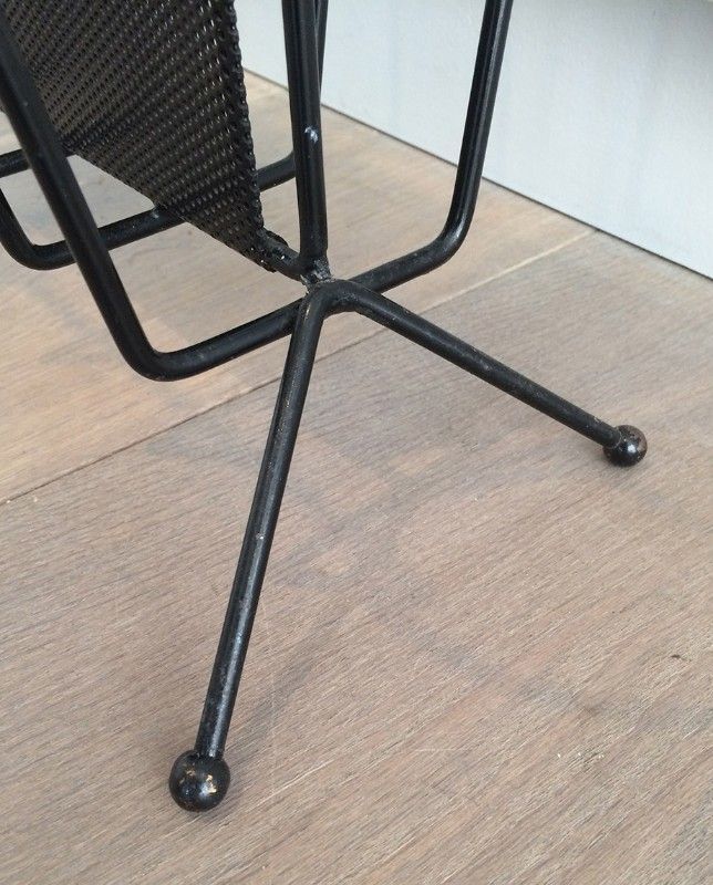 Black lacquered metal and perforated metal magazine rack designed by Mathieu Matégot 50.