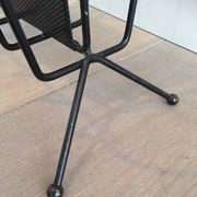 Black lacquered metal and perforated metal magazine rack designed by Mathieu Matégot 50.