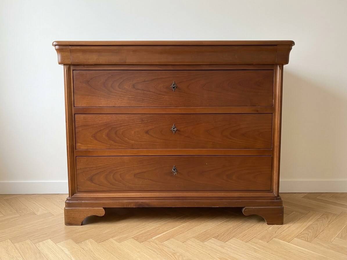 Antique solid wood chest of drawers with a secret drawer.