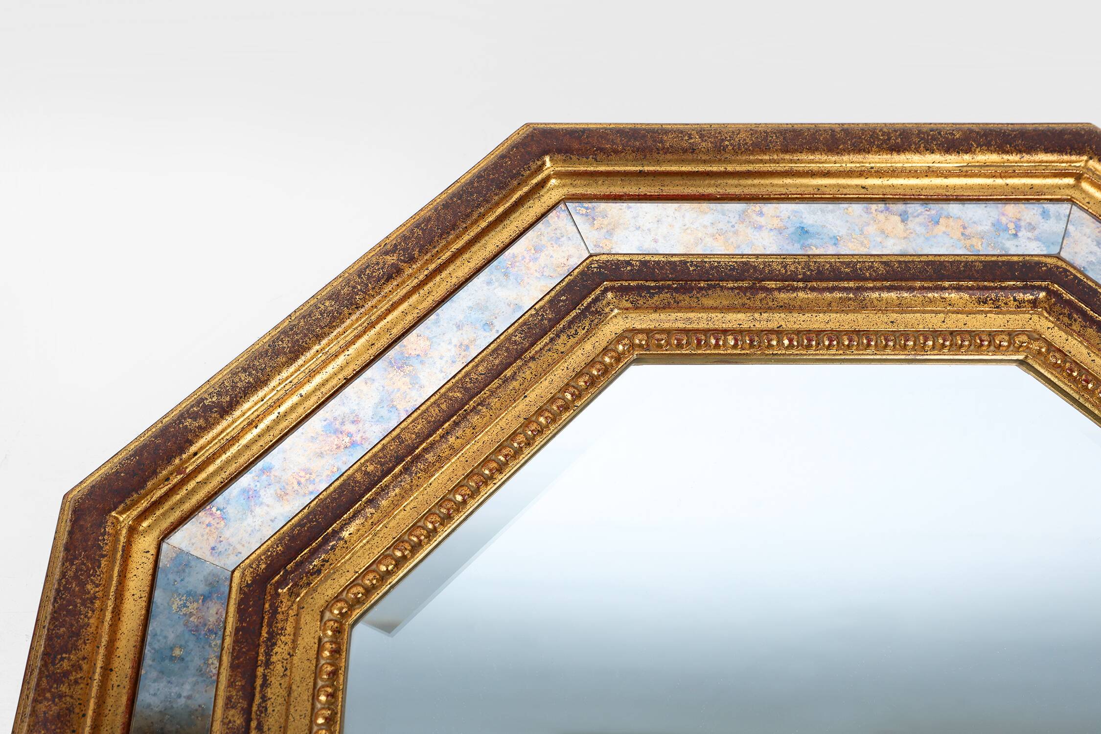 Gilded octagonal mirror by Deknudt Belgium decorated with smoked mirror gla