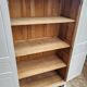 Antique Parisian wardrobe in white wood with shelves from the 1950s.
