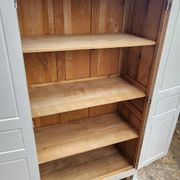 Antique Parisian wardrobe in white wood with shelves from the 1950s.