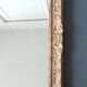 Large Montparnasse rocaille style frame in carved wood mounted in mirror.