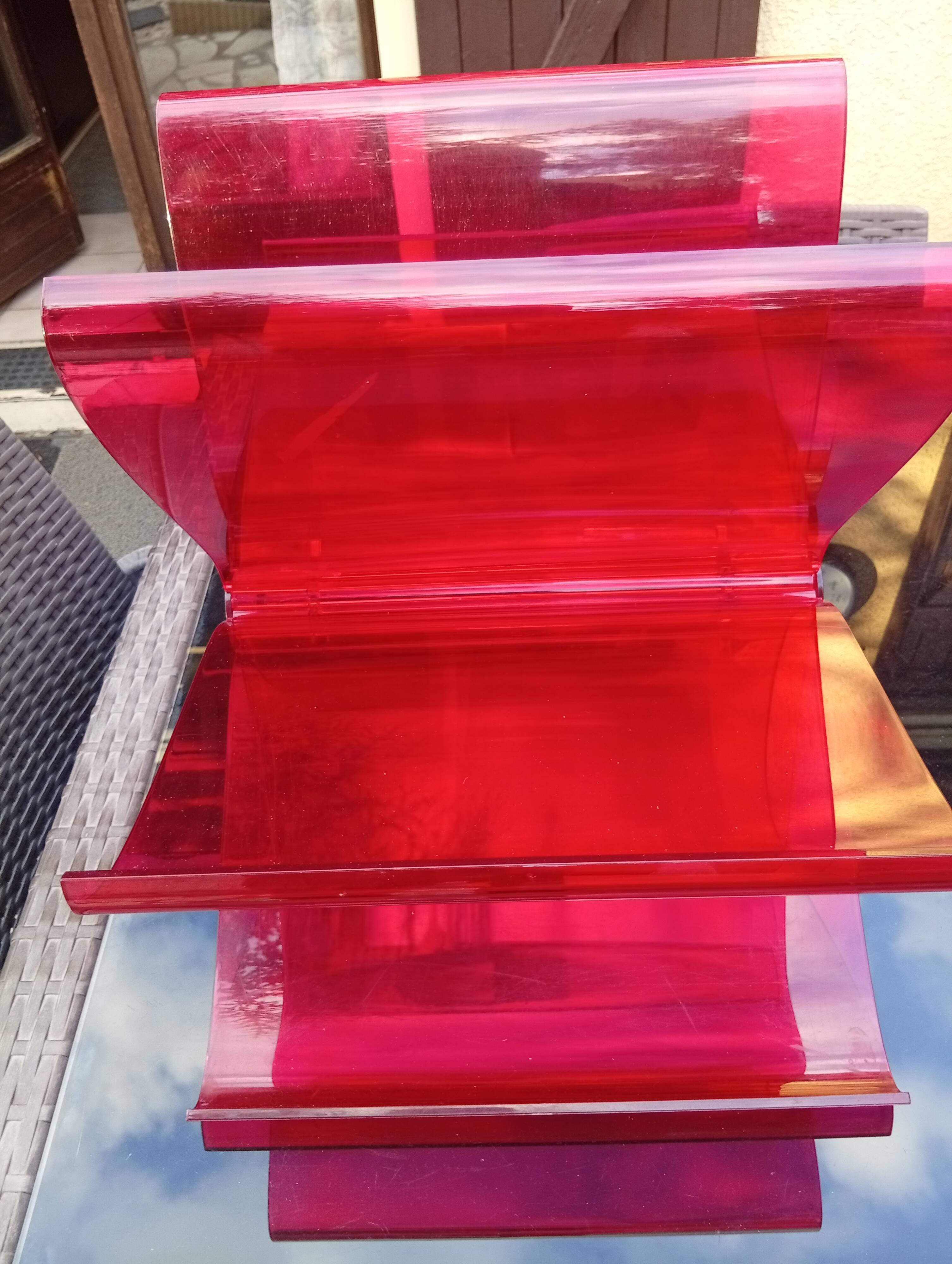 Kartell red magazine rack