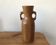 Olive wood flower vase.