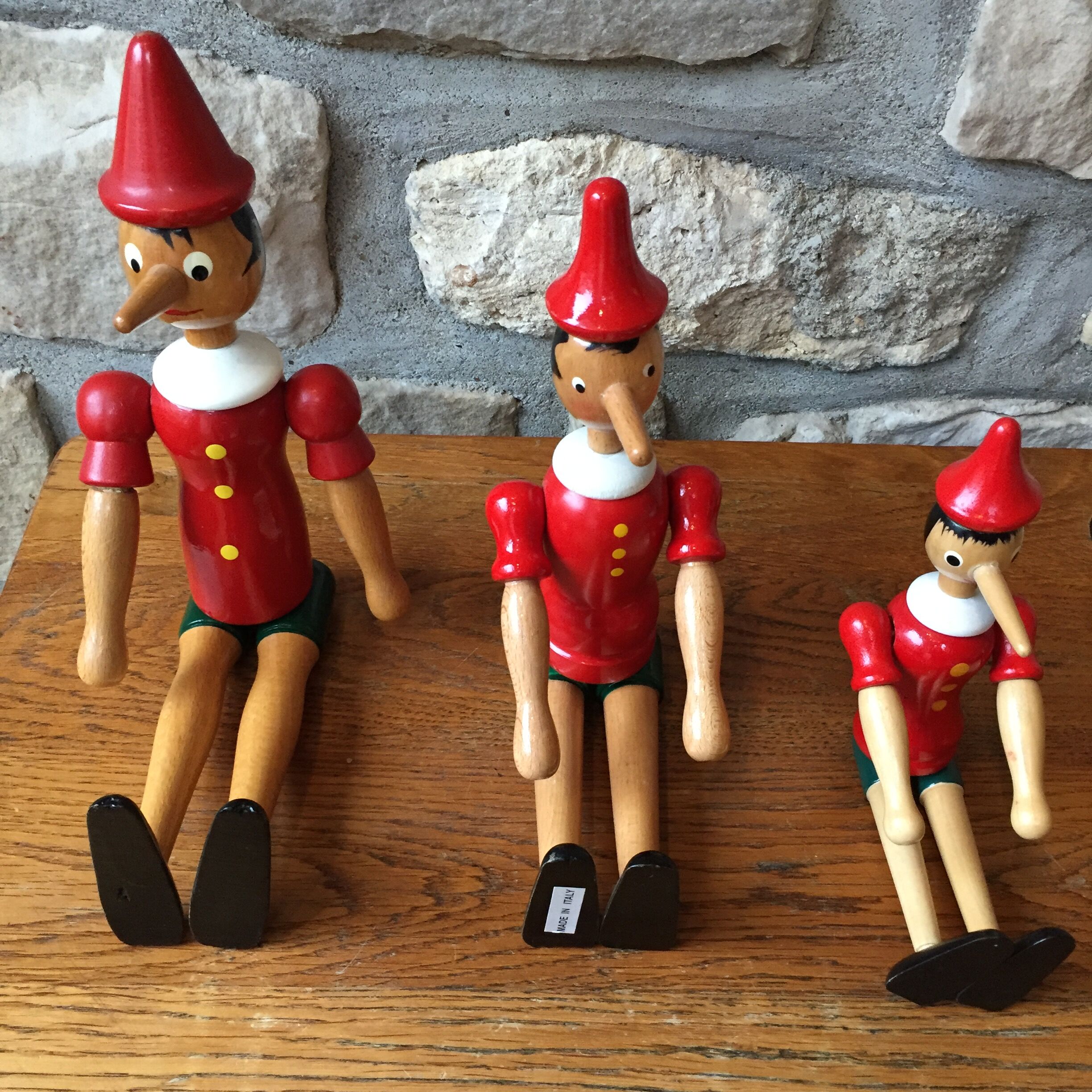 Trio of old wooden Pinocchio Made in Italy