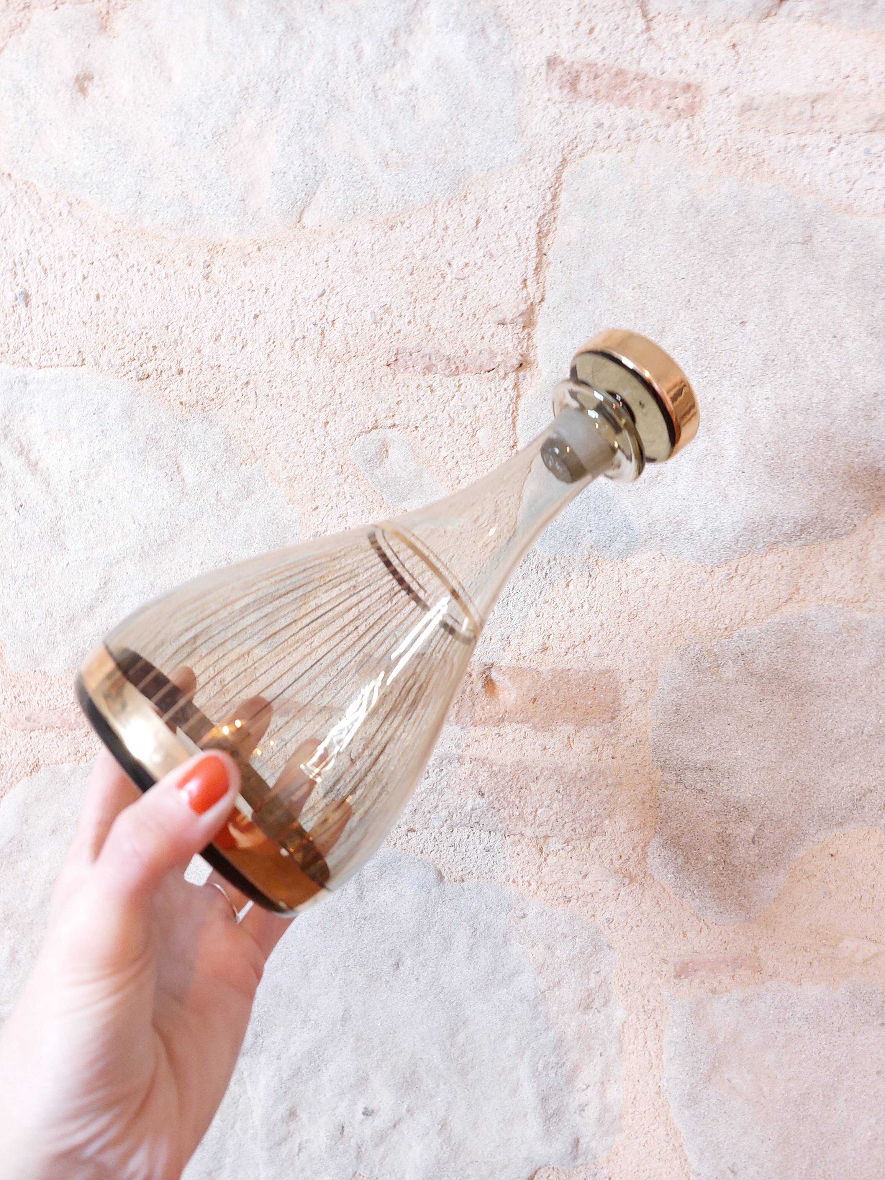 Vintage liqueur service, carafe and 7 amber brown glasses with gold edging