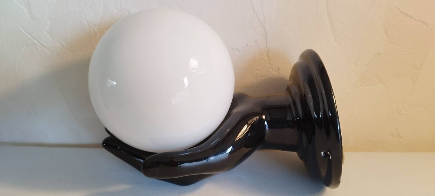 Hand-shaped wall light