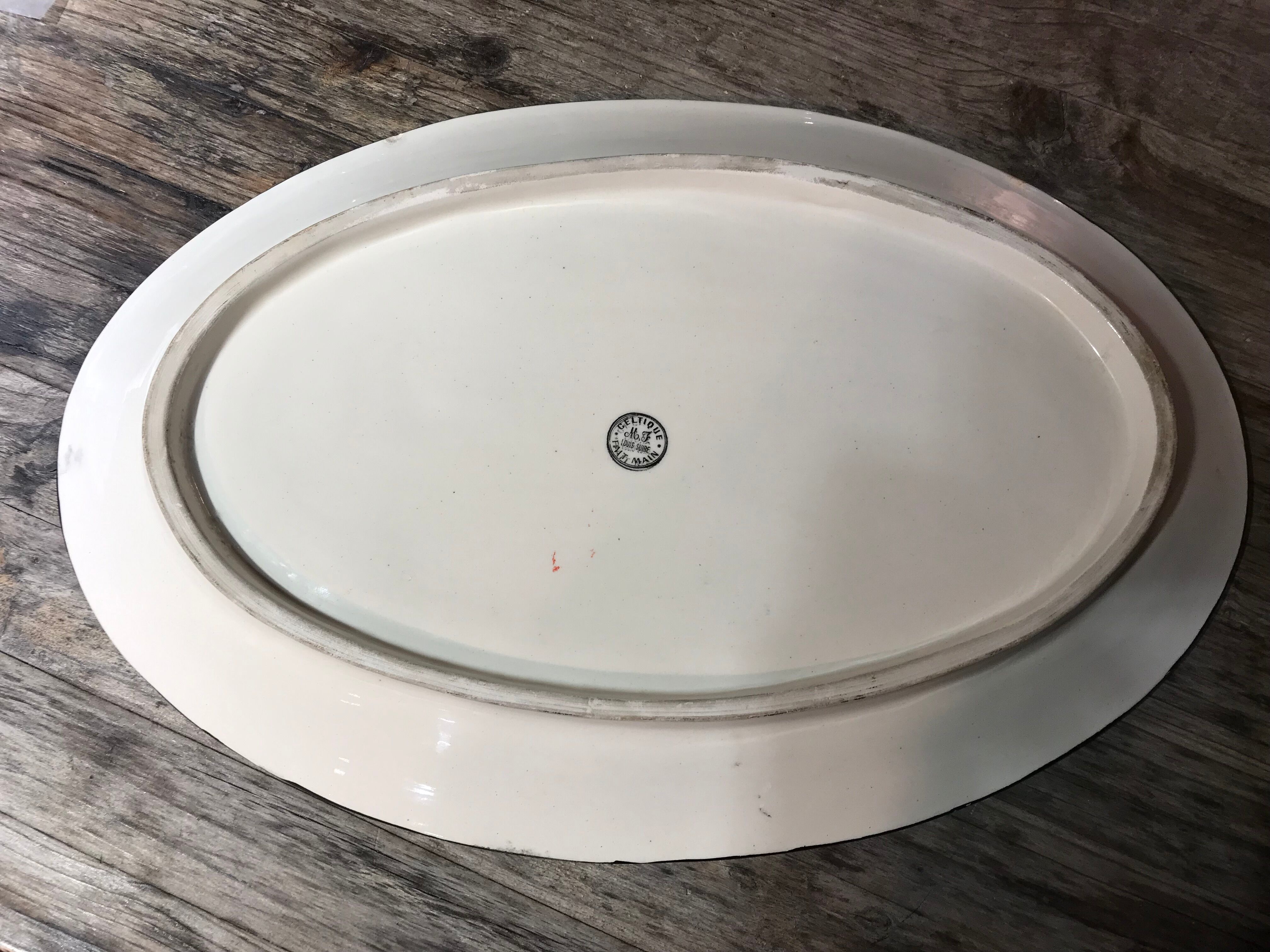 Old faience dish, Scéne Bretonne after Louis Suire and Masse Frères