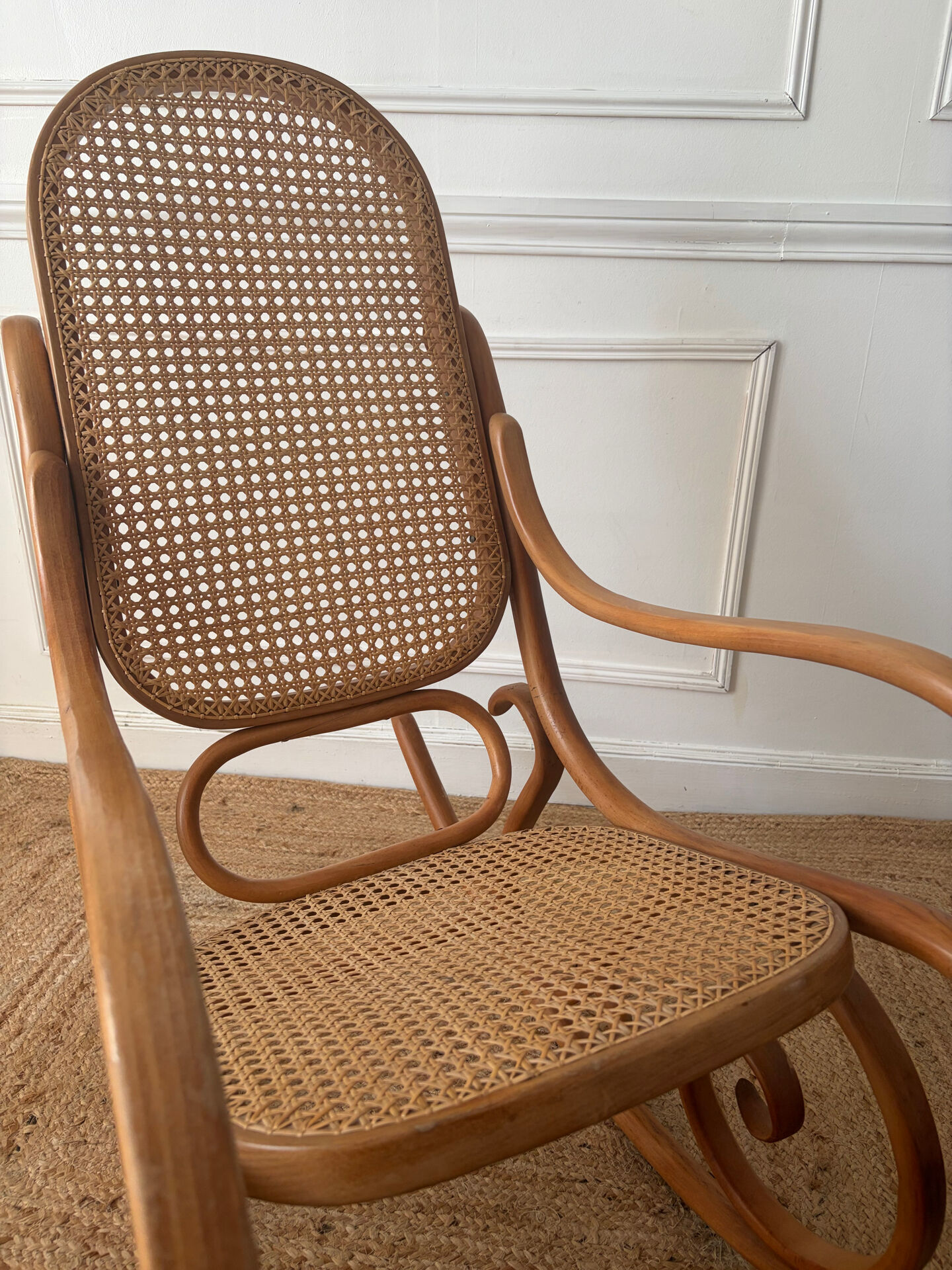 Curved wooden rocking chair