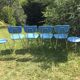 Lot of chairs and blue rockabilly stools