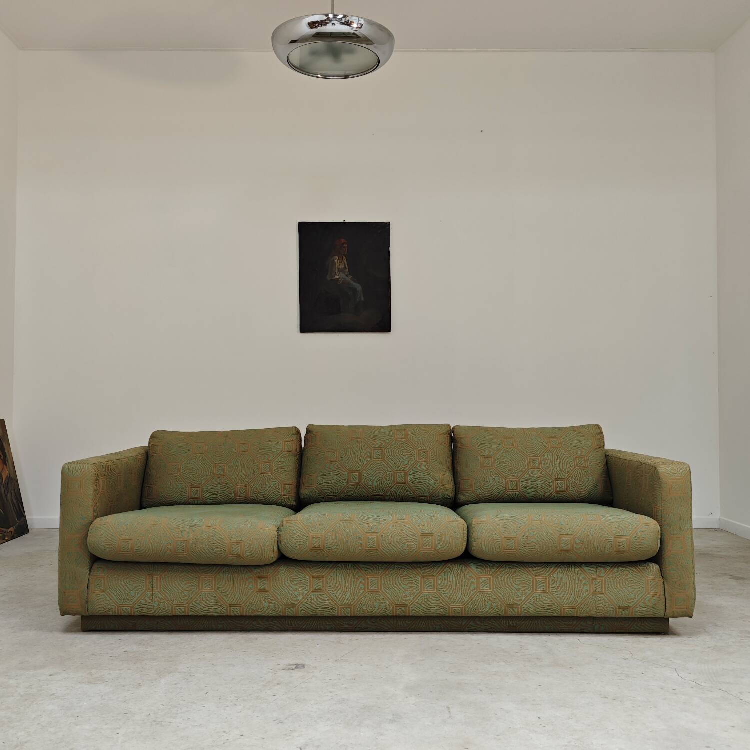Pierre Frey modernist bench in green and gold patterned fabric