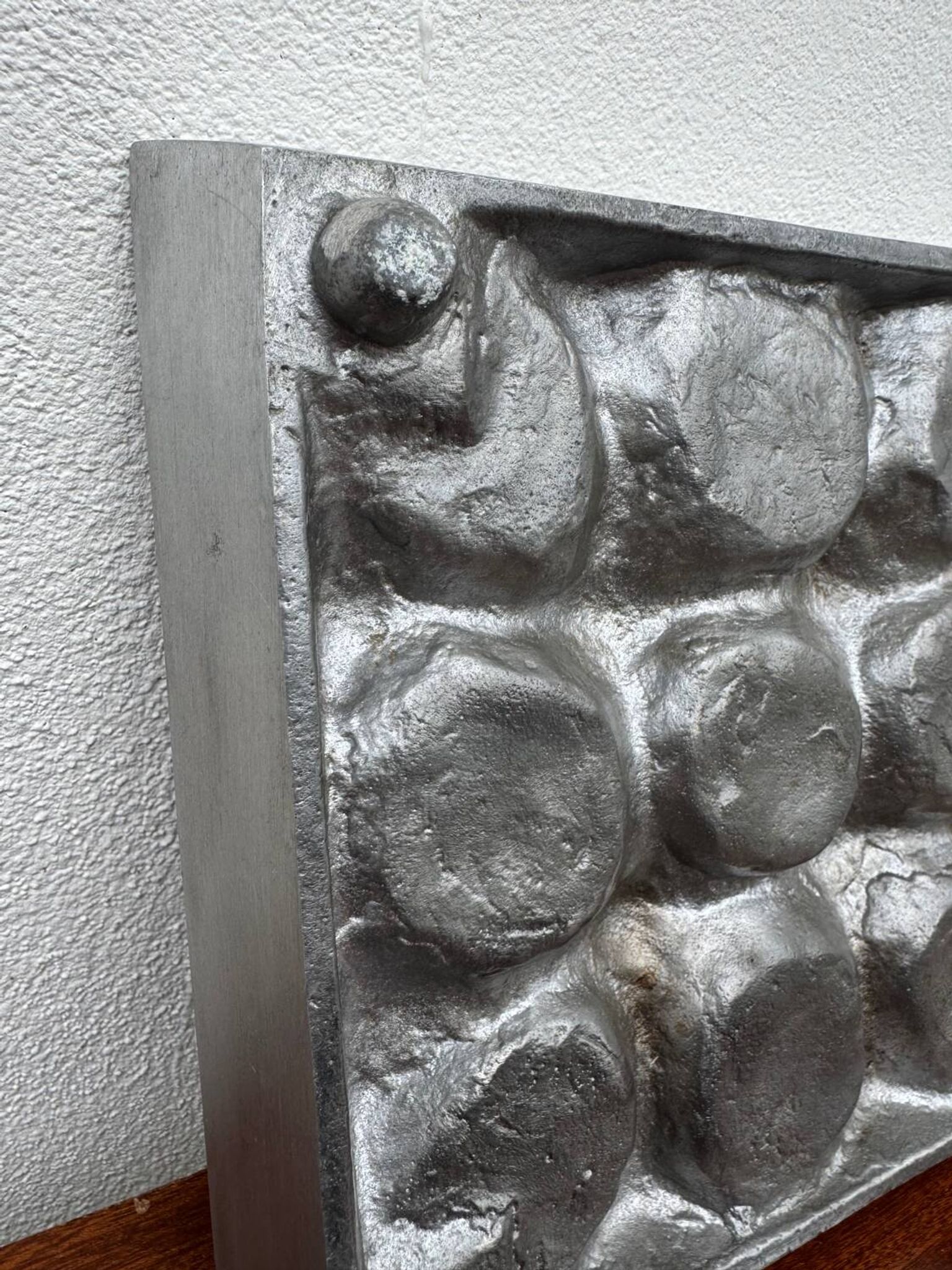 Brutalist style brushed aluminum candle holder