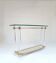 Hollywood Regency console table in lucite, glass and gold metal. 1980s